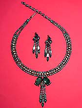 a beautiful vintage costume jewelry necklace and earrings