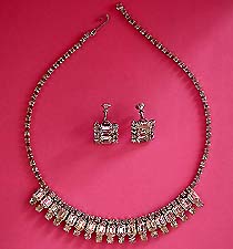 a beautiful vintage costume jewelry necklace and clip earrings