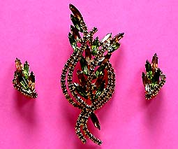a beautiful vintage costume jewelry brooch and earrings